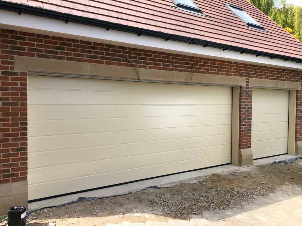 Light grey classic roller garage door on a suburban home